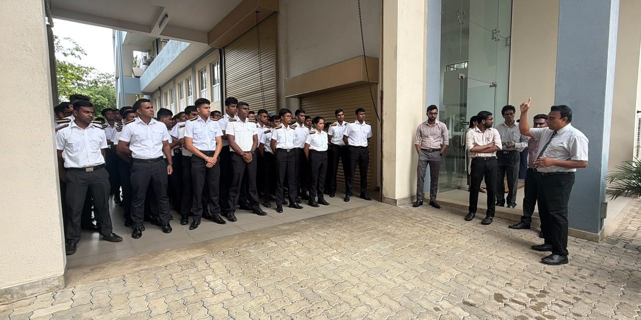Students and staff gathered at the assembly area during the emergency fire drill Students and staff gathered at the assembly area during the emergency fire drill